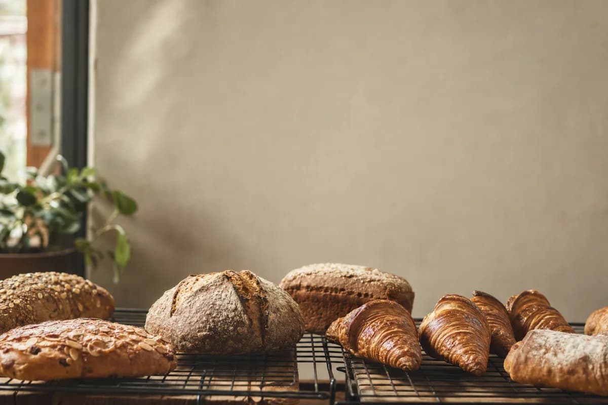 Fresh baked bread and pastries cooling on a wire rack